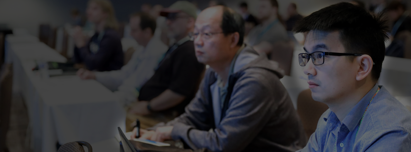 Attendee takes notes during a conference session photo