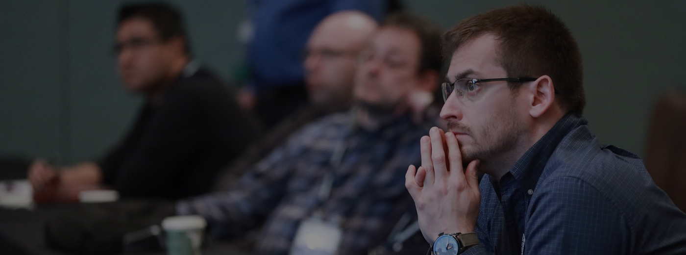 Man listens during a conference