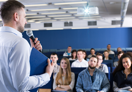 Speaker addresses an audience photo