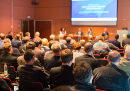 Audience watching a panel discussion photo