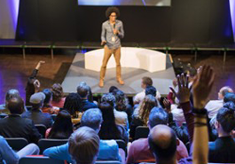 Woman addresses an audience photo