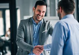 Two businessmen shake hands photo